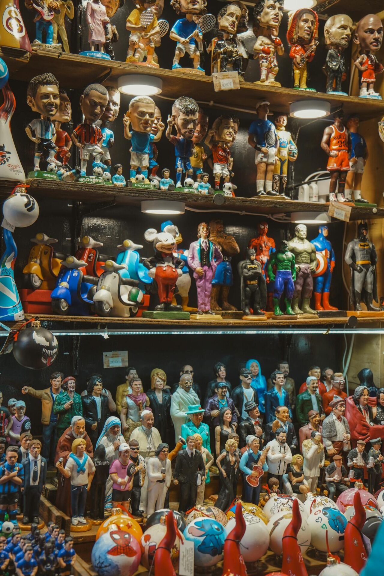Vibrant collection of figurines on shelves showcasing pop culture icons in a Naples shop.